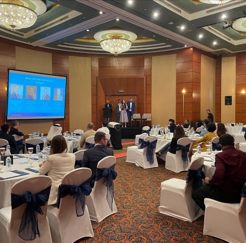 UAE Network members watching a presentation 