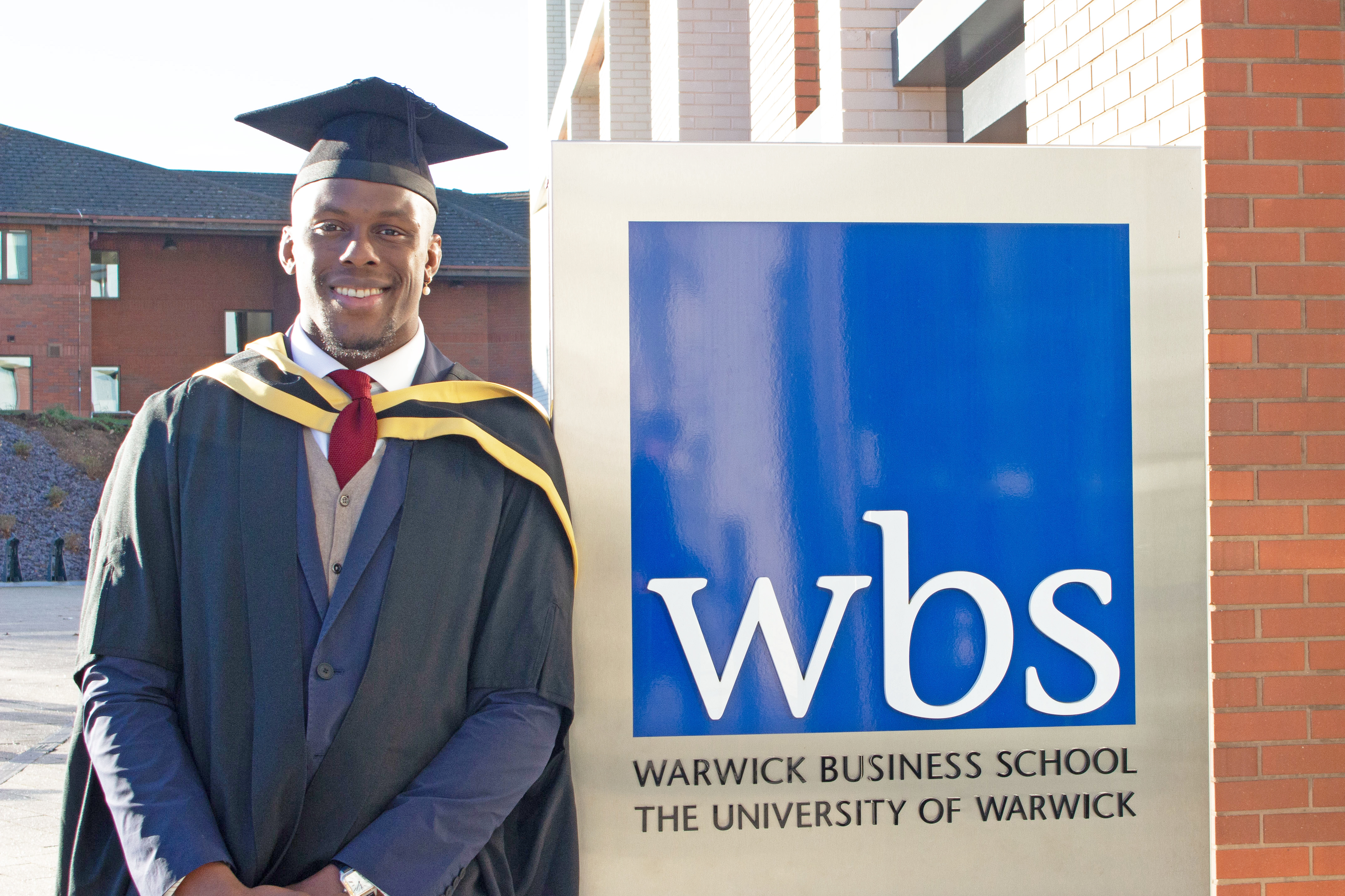 England and British Lions captain Maro Itoje in front of Warwick Business School in an academic cap and gown as he graduates after earning his MBA.