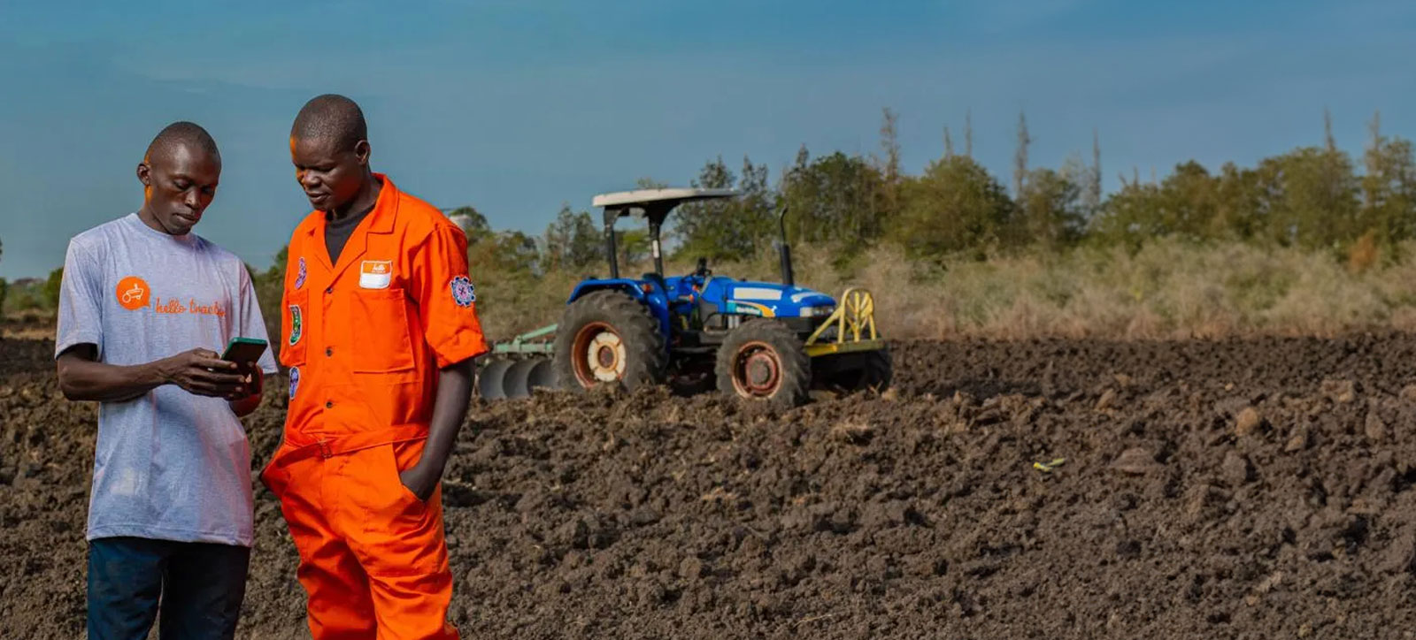 A Hello Tractor rep introduces a farmer to the start-up