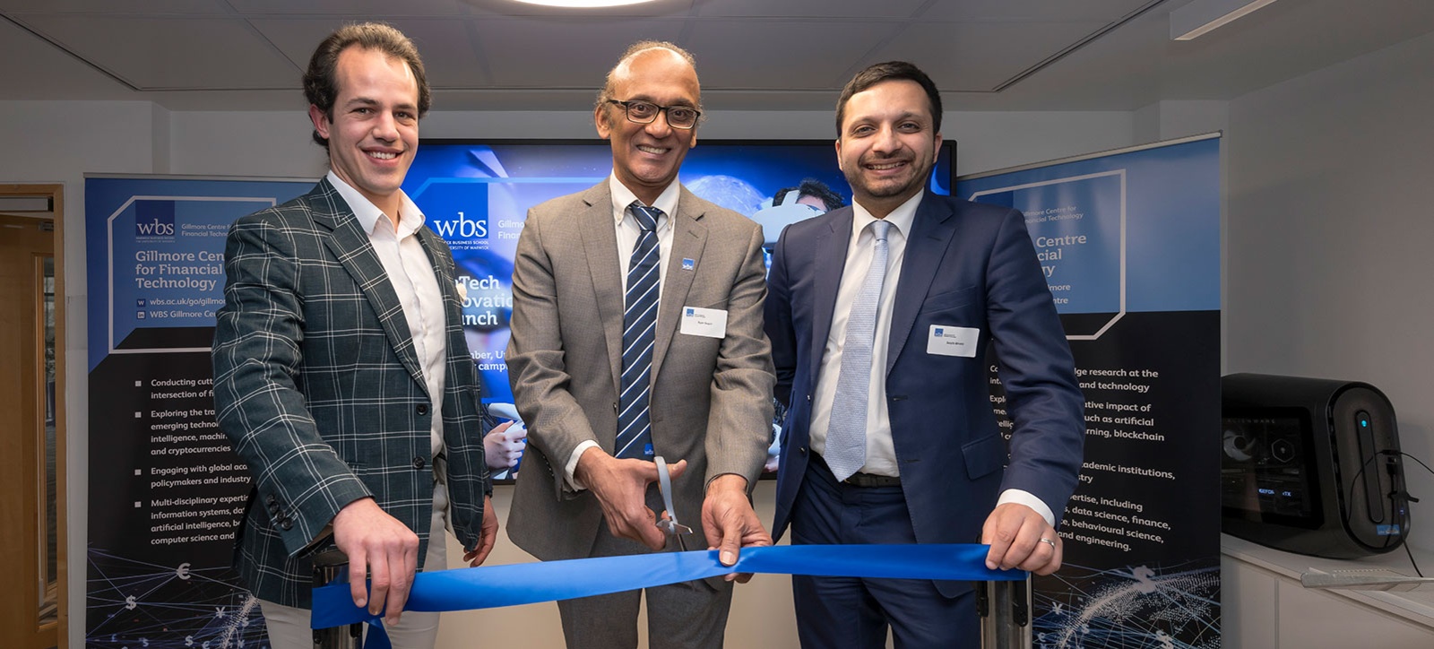 Investing in tomorrow: (l-r) Moris Strub, Course Director for the MSc Fintech, Ram Gopal, Director of the Gillmore Centre for Financial Technology, and Saqib Bhatti, Shadow Minister for Science, Innovation and Technology, opening the Fintech Innovation Lab by cutting the blue ribbon