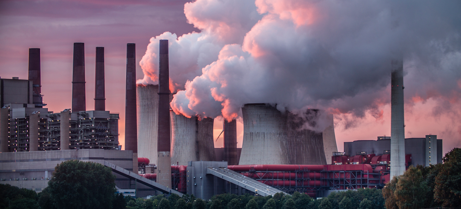 Smoke billows from the chimneys of a coal-fired power station like the one at Radcliffe-on-Soar.