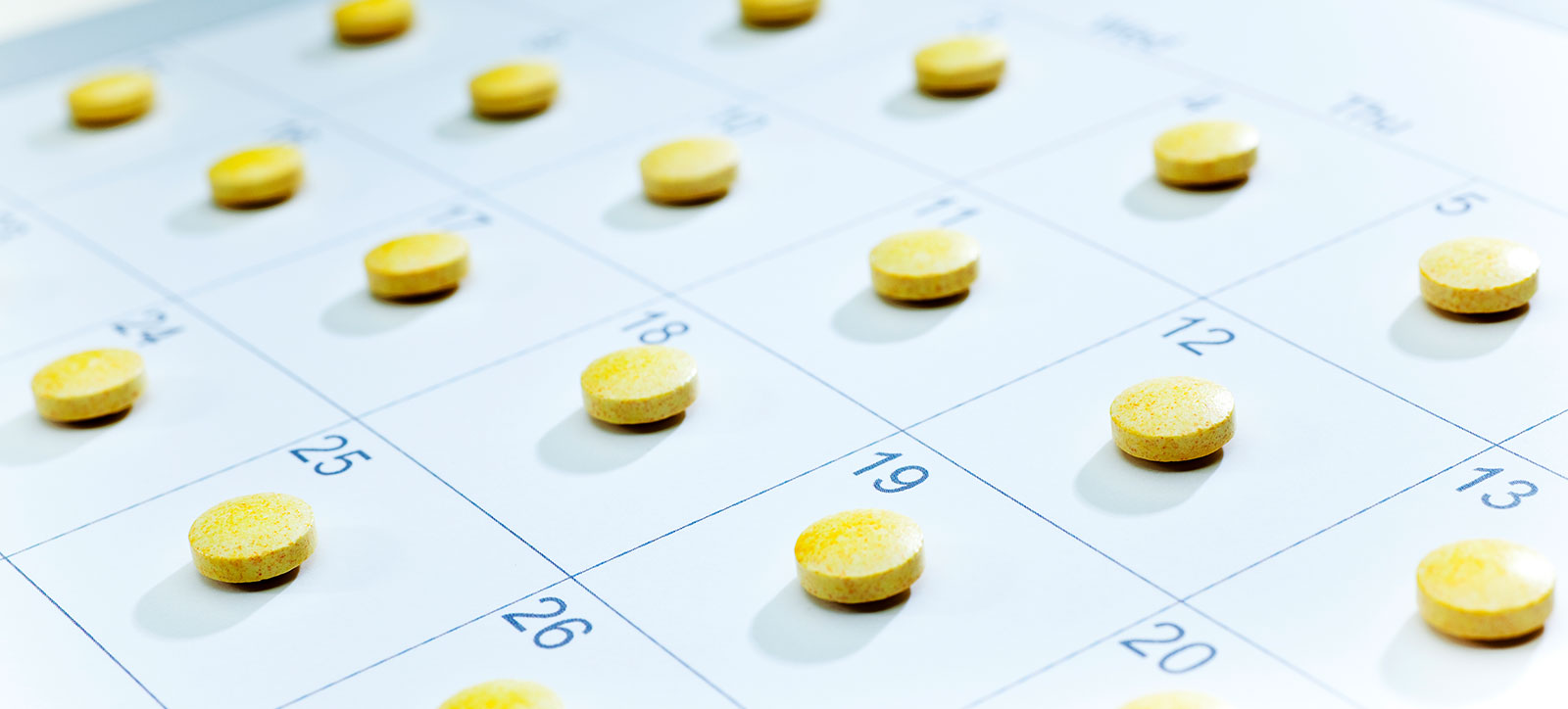 A calendar with a pill on each day to remind a patient to take their medication as prescribed